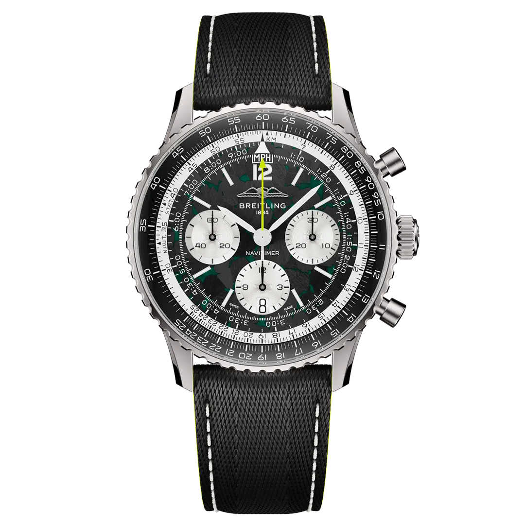 BREITLING Navitimer B01 Chronograph 43 Aston Martin Aramco Formula One Team Edition with a black dial, three white sub-dials, a slide rule bezel, and a black textured strap with white stitching.
