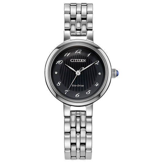 The CITIZEN L Classic Eco-Drive 27.7mm Watch features a silver-toned linked band, black dial with silver numerals, three hands, and a round case accented by a blue crown detail for added elegance.