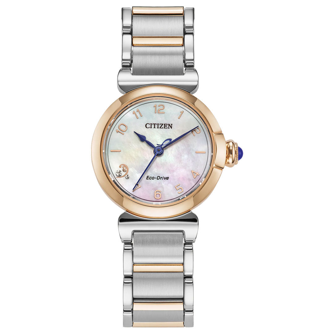 The CITIZEN L Mae Eco-Drive 26mm women’s watch features a mother-of-pearl dial, gold-tone bezel, silver and gold-tone bracelet, gold markers, and a diamond at 7 o’clock. Sustainable luxury by CITIZEN.