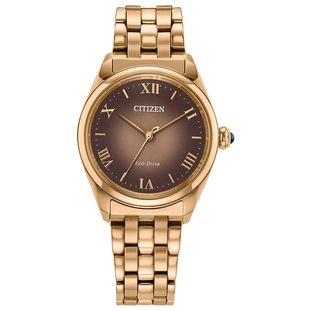 The CITIZEN L Classic Eco-Drive 33mm Watch features a gold round case, brown dial, gold Roman numeral markers, three hands, and a gold link band.