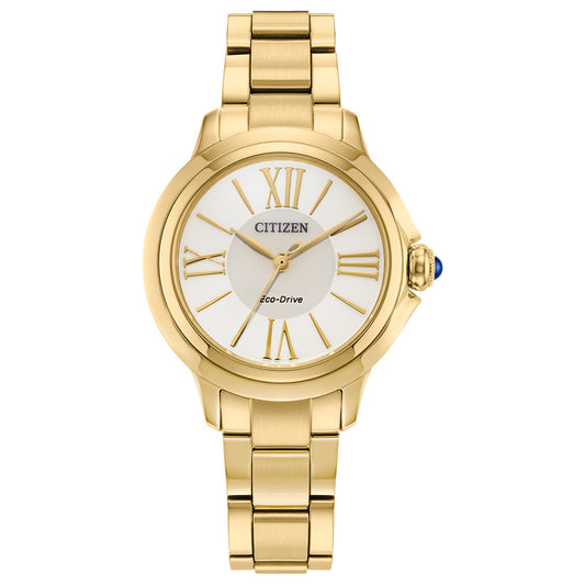 The CITIZEN Le L Ceci Eco-Drive 31.5mm watch features a round white dial with gold Roman numerals and hands, a gold-tone stainless steel case and bracelet, and a subtle blue crown accent, making it a chic choice among elegant women's watches.