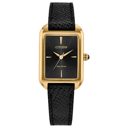 The CITIZEN Dress Classic Eco-Drive 23.5mm Watch features a yellow gold-tone rectangular case, minimalist black dial with gold markers and hands, and a textured black leather strap.