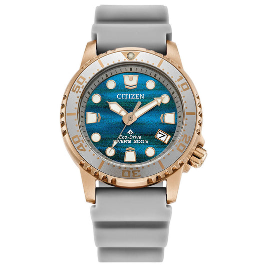 The CITIZEN Promaster Dive Eco-Drive 36.5mm Watch Limited Edition features a bronze case, blue dial, luminous markers, date at 4 o'clock, light gray silicone strap, minute-marked bezel, and 200m water resistance.