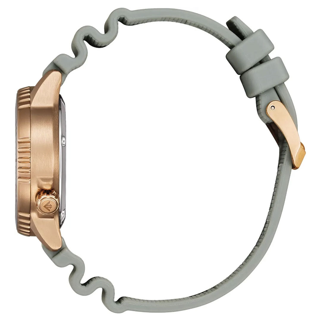 Side view of the CITIZEN Promaster Dive Eco-Drive 36.5mm Limited Edition watch, featuring a rose gold-tone stainless steel case, textured bezel, light gray wavy silicone strap with gold buckle, and visible crown and case detailing.
