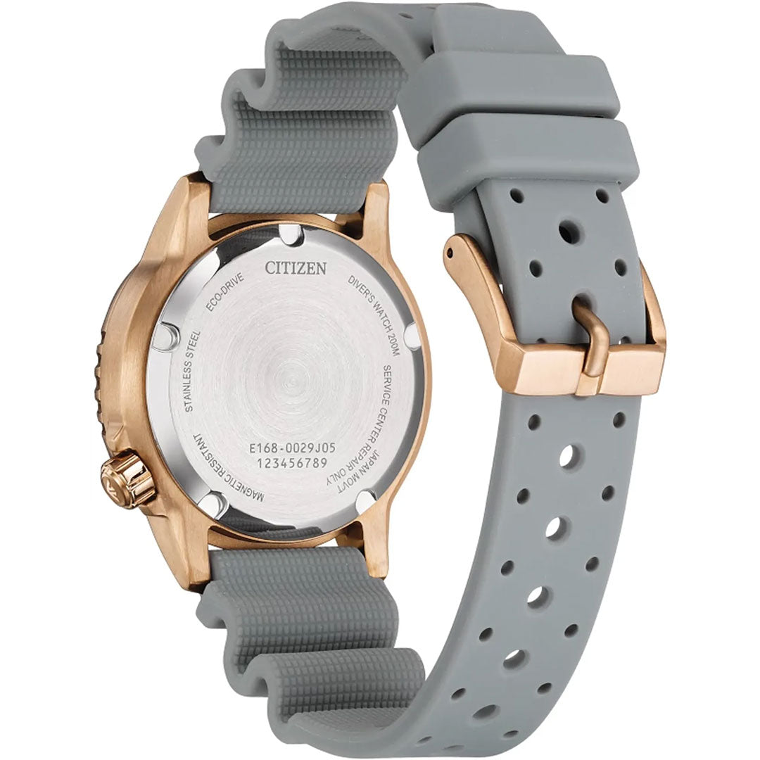 Back view of the CITIZEN Promaster Dive Eco-Drive 36.5mm Watch Limited Edition shows a rose gold-tone case, silver backplate with engravings, and a light gray perforated silicone strap with a gold buckle.