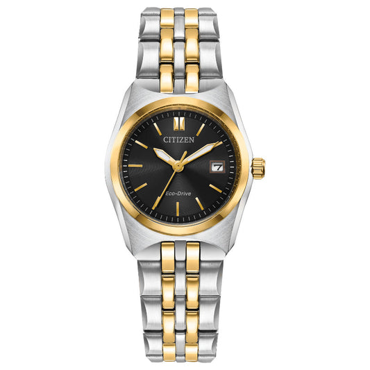 The CITIZEN Corso Eco-Drive 28mm Watch offers a sophisticated silver and gold-tone metal bracelet, beautifully complementing its sleek black dial adorned with gold hour markers. The elegant design is further accentuated by a stylish date window at the three o'clock position and a gold-tone bezel, combining functionality and chic aesthetics for an exquisite timepiece.