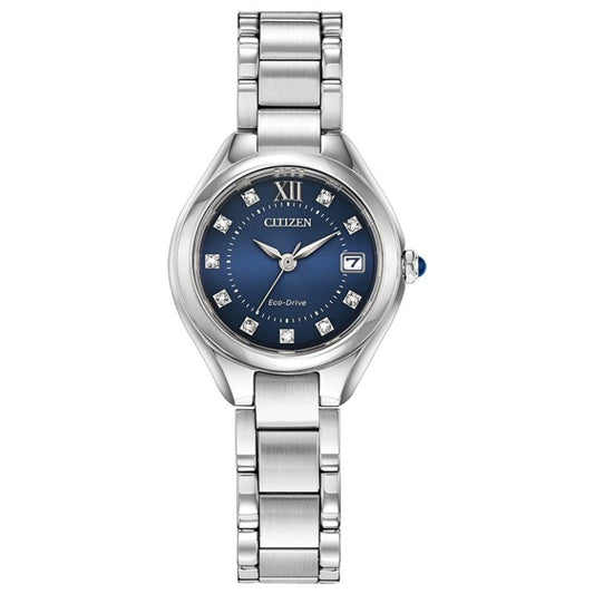 The CITIZEN Silhouette Crystal Eco-Drive 28mm Watch is a silver timepiece featuring a striking blue face adorned with diamond-like hour markers and enhanced by Swarovski crystals. It includes a Roman numeral XII, date display, and a metal link bracelet.