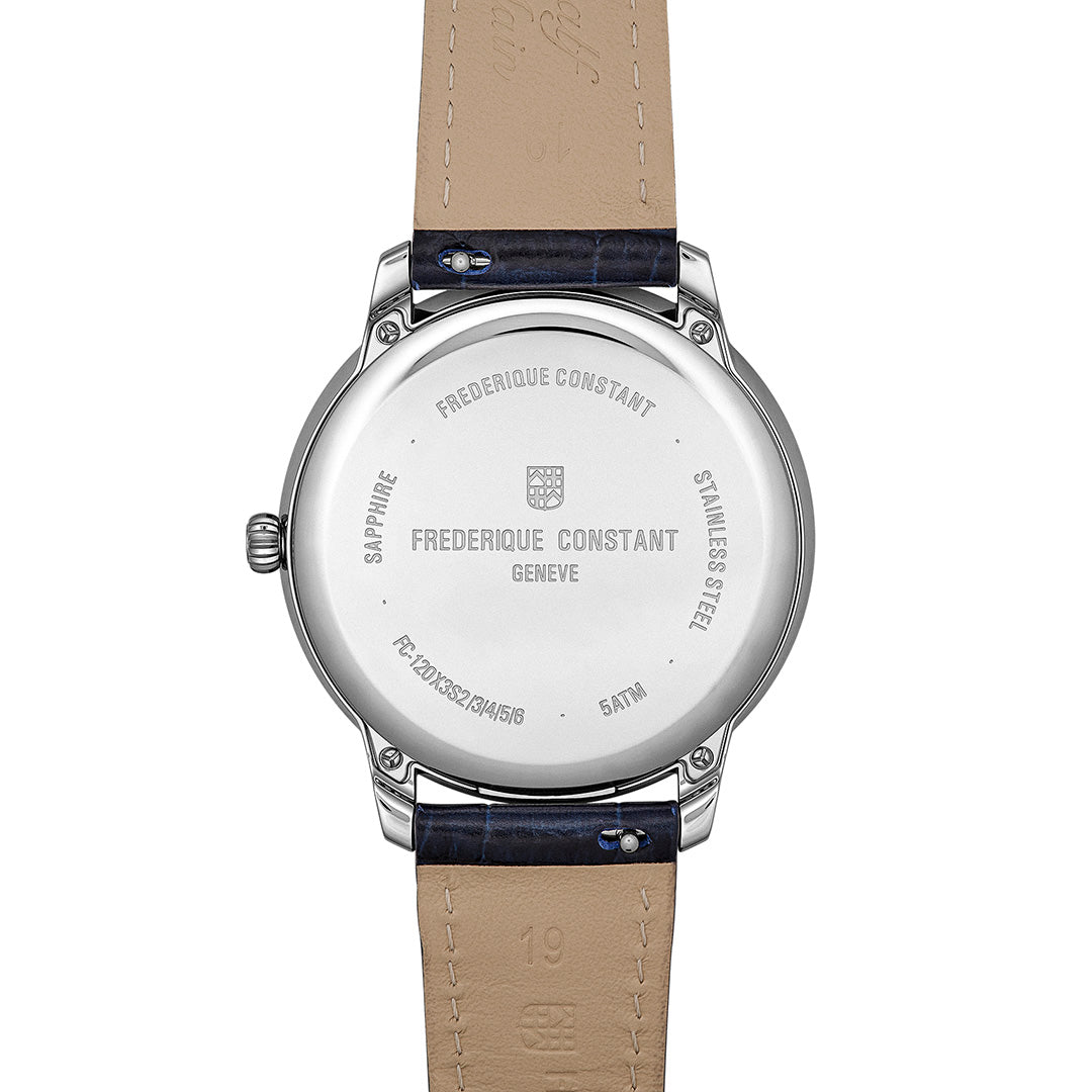 The stainless steel case back of a Frederique Constant Classics Moneta Solarmetre 39mm Watch with a dark blue leather strap, showing engravings of the brand name, model details, and water resistance.