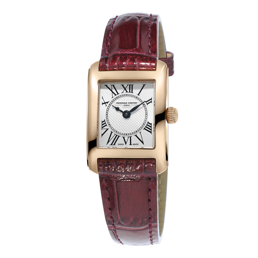 The Frederique Constant Classics Carree Quartz 23mm x 21mm watch boasts a classic white dial adorned with Roman numerals and a decorative center, all set within a rectangular gold case. It is elegantly paired with a red-brown leather strap.