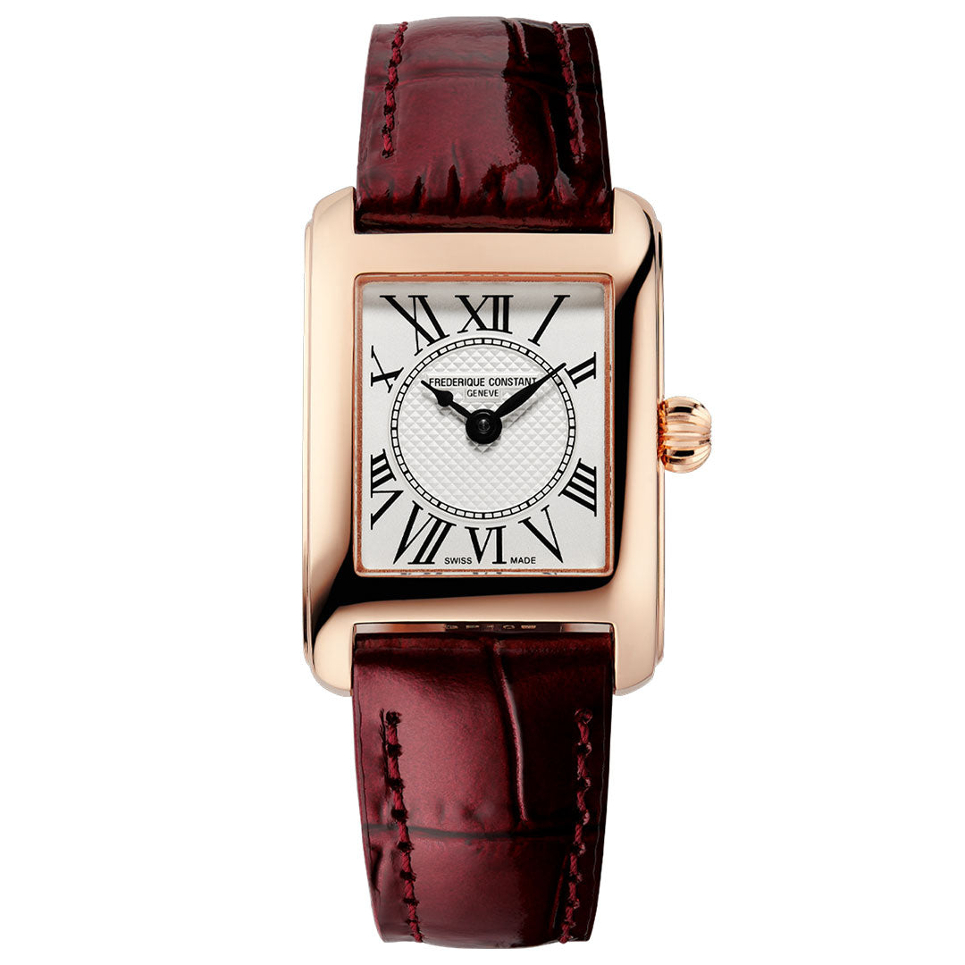 A sophisticated women’s timepiece from the Frederique Constant Classics Carree Quartz collection, this rectangular gold watch features a 23mm x 21mm case, a white dial with black Roman numerals, and a textured center. The Frederique Constant brand name is elegantly displayed on the dial, complemented by a dark red crocodile-patterned leather strap—capturing timeless luxury in every detail.