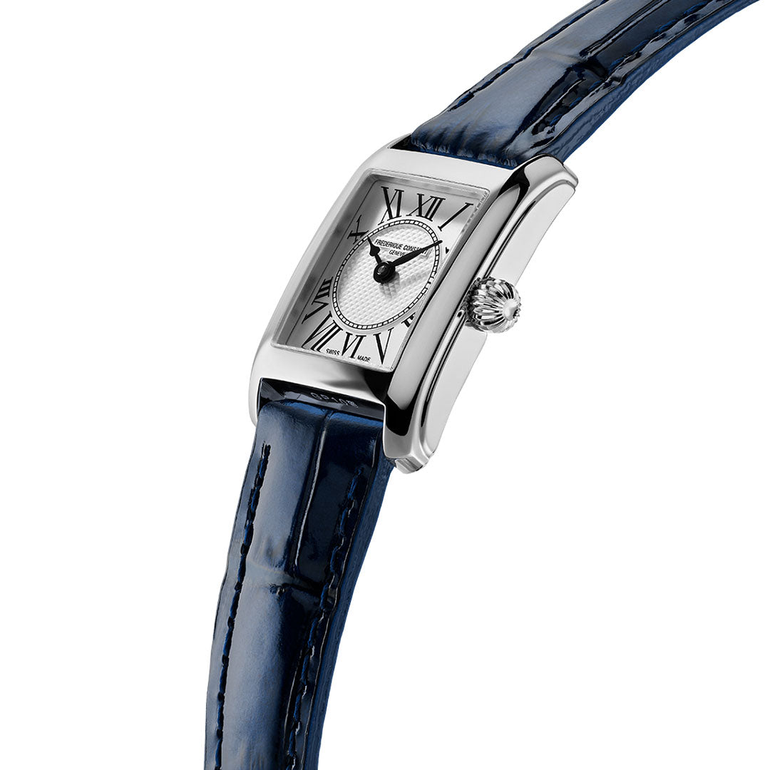 The Frederique Constant Classics Carree Quartz 21mm x 15mm silver rectangular wristwatch features Roman numerals, a textured dial, and a blue leather strap, shown angled on a white background.