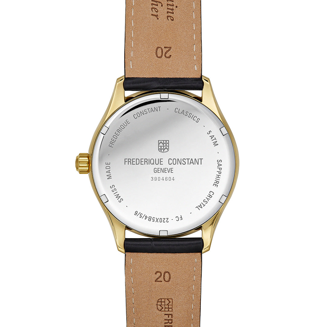 Back view of a gold-plated Frederique Constant Classics Quartz Date 40mm Watch with a black leather strap, showing engravings on the case back including the brand name, serial number, and water resistance rating.