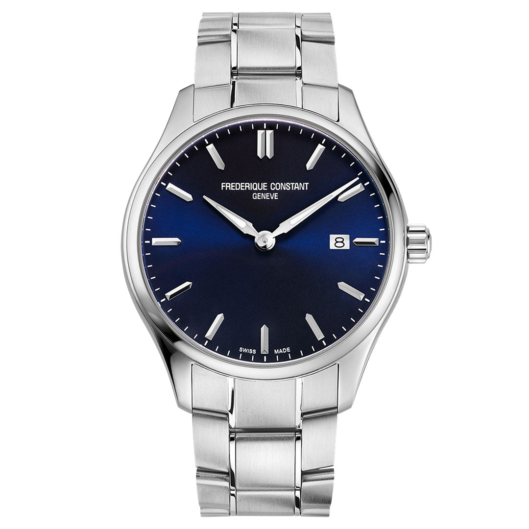 The Frederique Constant Classics Quartz 40mm Watch features a navy blue gradient dial, silver hour markers and hands, a date window at 3 o’clock, and a matching stainless steel bracelet. Time shown is set to 10:10.
