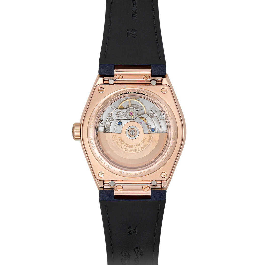 The image features the back of the Frederique Constant Highlife Automatic COSC 39mm Watch, highlighting its visible automatic movement. The rose gold case paired with a black strap makes it ideal for everyday wear, and its complex mechanics—complete with gears and a rotor—are elegantly showcased through a transparent case back.