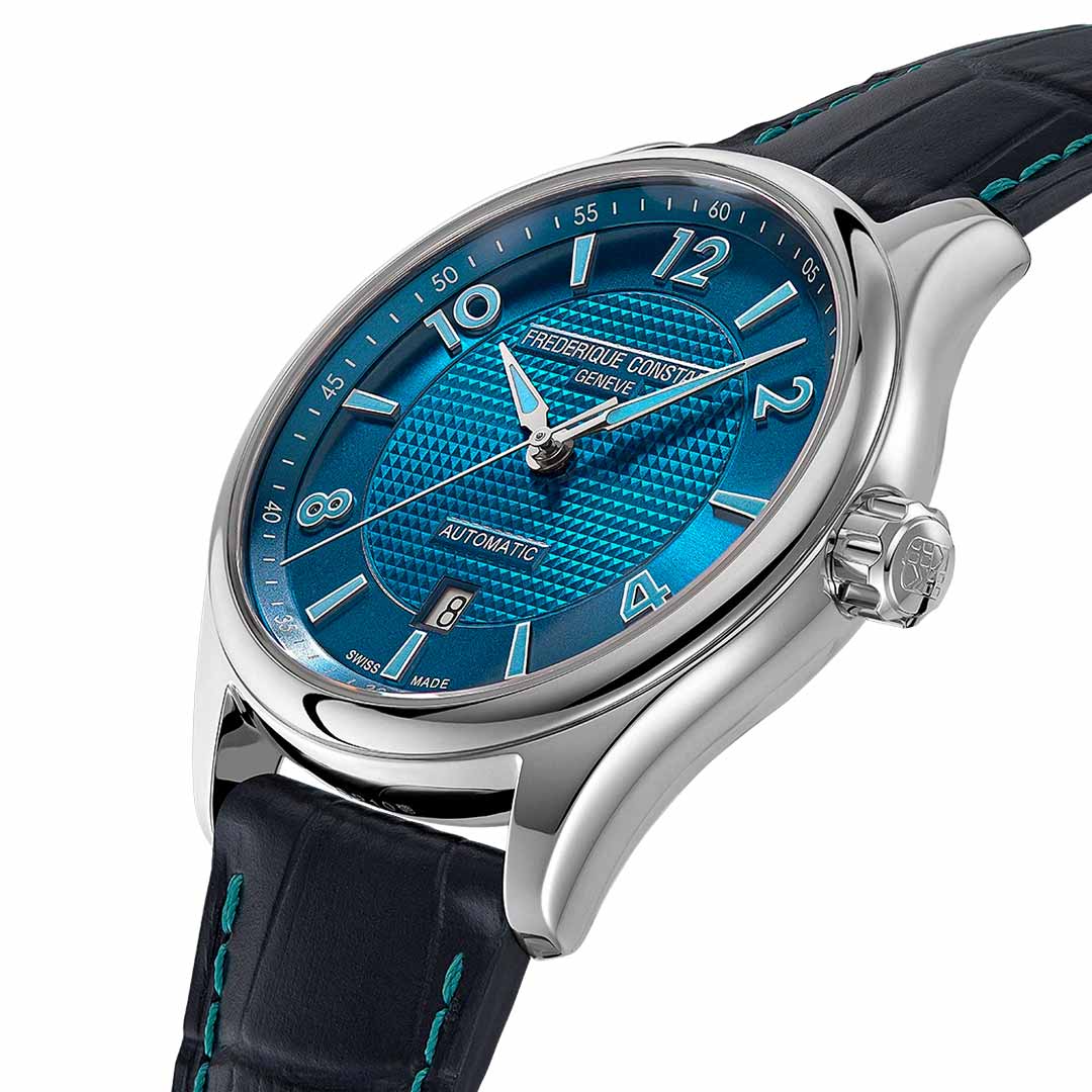 The Frederique Constant Classics Runabout Limited Edition Automatic 42mm Watch boasts a striking blue face encased in silver, complemented by a blue leather strap. The textured dial features silver hour markers and a date window located near the 6 o'clock position, echoing the elegant design elements of Runabout yachts. The dial is adorned with the words "Frederique Constant" and "Automatic.