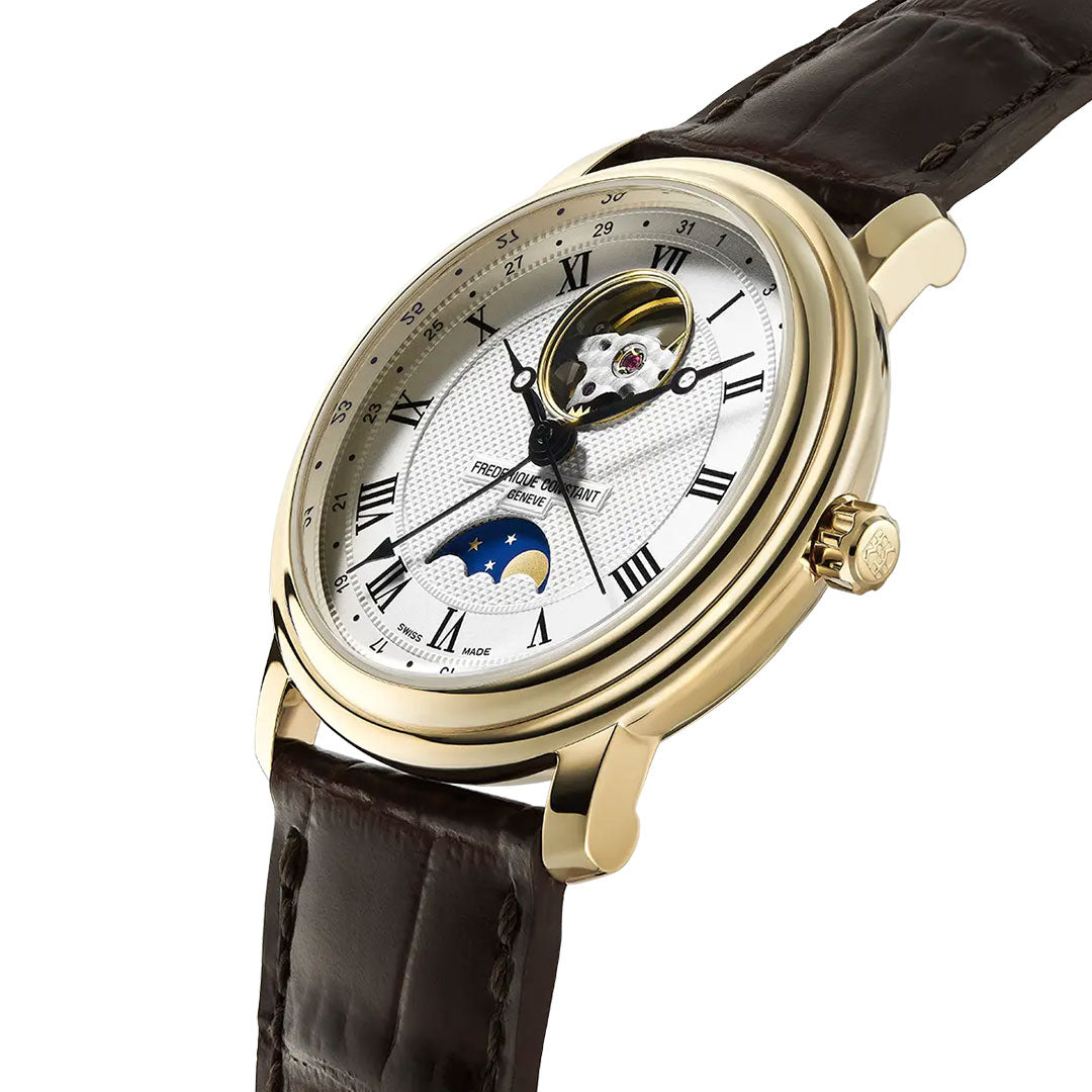 The Frederique Constant Classics Heart Beat Moonphase Date Automatic 40mm Watch features a gold case, white guilloché clous de paris dial with Roman numerals, open heart and moon phase displays, and a brown leather strap. Shown angled on a white background.