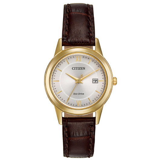 The CITIZEN Corso Eco-Drive 28mm Watch boasts a classic design with a gold case and white dial, accented by a brown leather strap. It features Roman numerals at the 12, 3, 6, and 9 positions, along with a convenient date window at the 3 o'clock position.