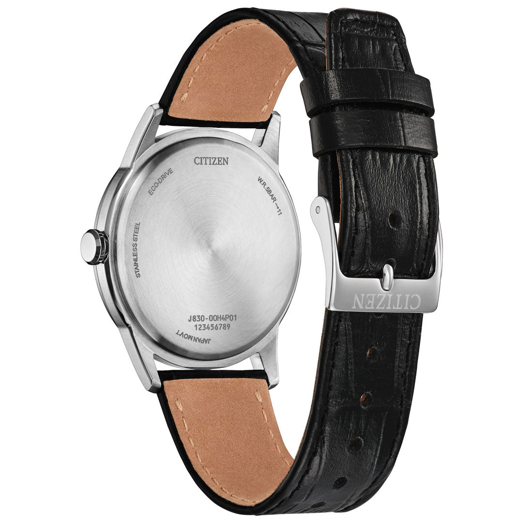 Back view of the CITIZEN Rolan Eco-Drive 37mm Watch by CITIZEN, featuring a black leather strap with a tan underside, a stainless steel case and back engraved with the model and serial numbers, and a silver clasp engraved with “CITIZEN.”.