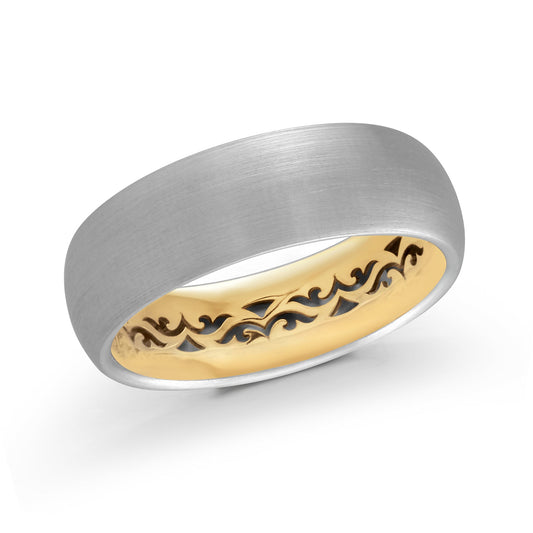 The Malo 14K White and Yellow Gold 7mm Wedding Band features a silver brushed exterior and a gold interior adorned with an intricate wave pattern. This exquisite piece is captured elegantly against a white background.