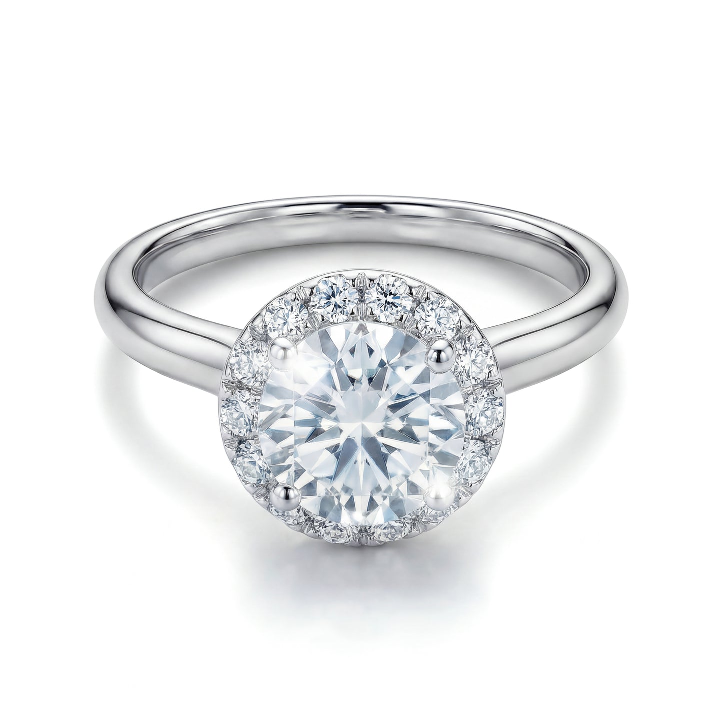 The Raffi&Co.® 14K White Gold Round Brilliant Diamond Halo Engagement Ring features a round brilliant diamond with a sparkling halo on a polished band, shown against a white background.