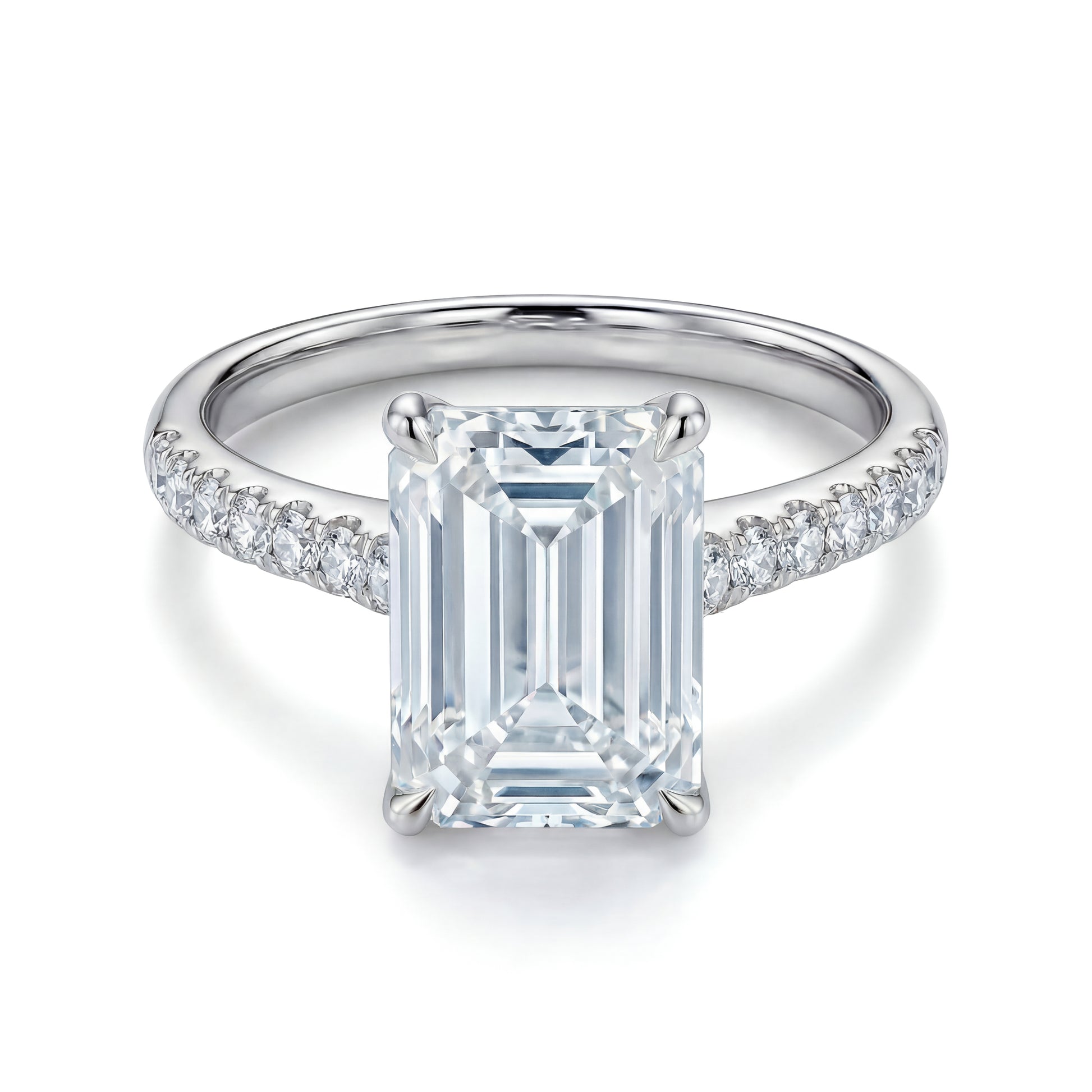 The Raffi&Co.® 14K White Gold Emerald Hidden Halo Diamond Engagement Ring features a large center stone with round diamonds along the band, shown against a white background.