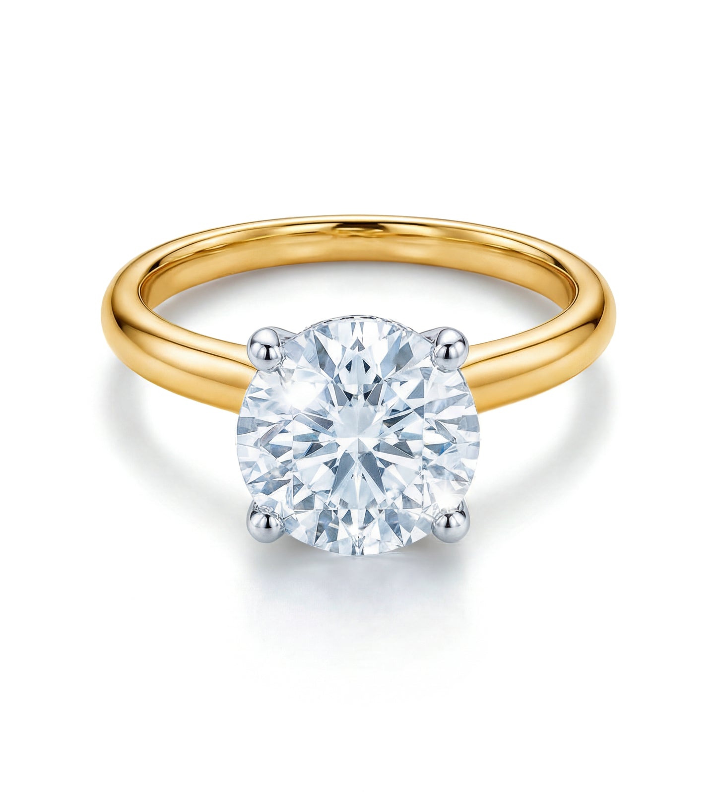 The Raffi&Co.® Signature 18K Yellow Gold Round Brilliant Solitaire Diamond Engagement Ring features a GIA certified diamond in a four-prong white gold or platinum setting, elegantly displayed against a white background.