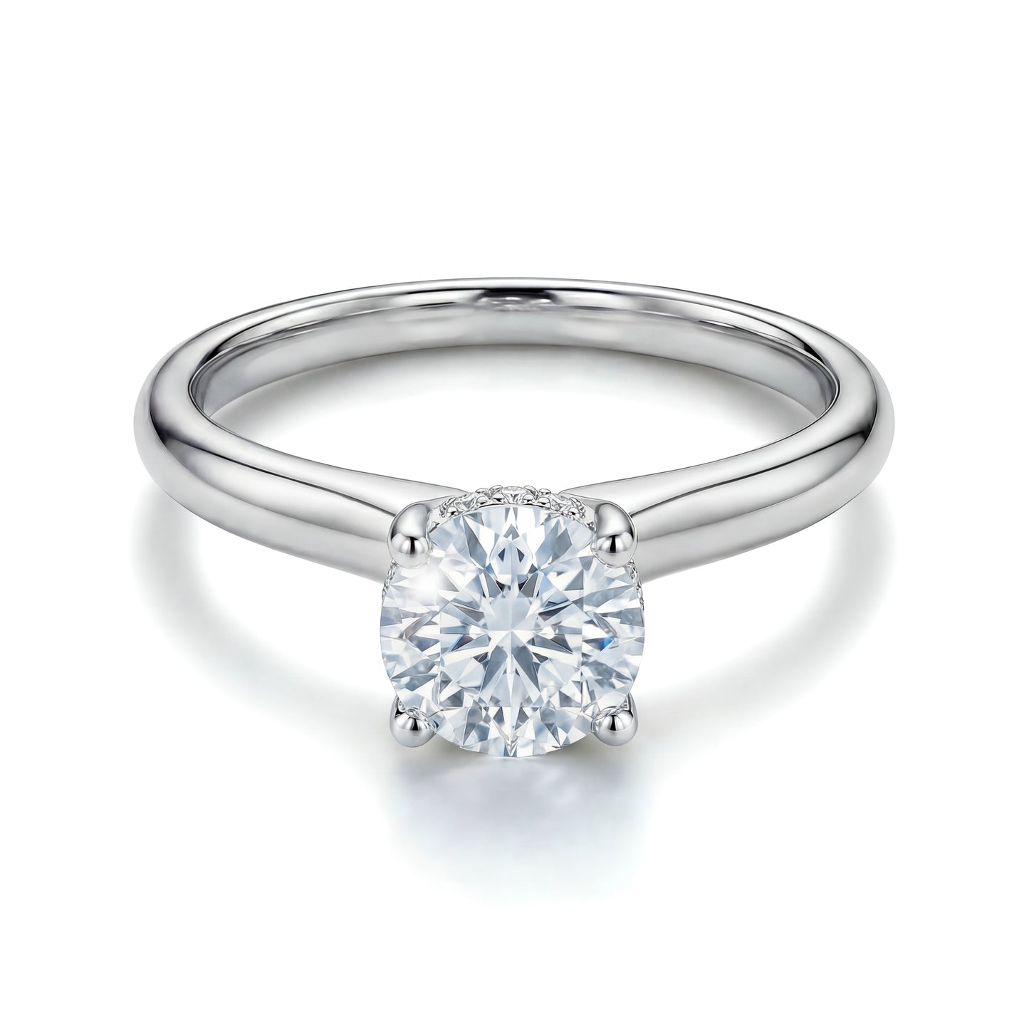The Raffi&Co.® 14K White Gold Round Brilliant Lab Diamond Hidden Halo Engagement Ring features a round lab diamond in a classic four-prong setting, displayed on a white background.