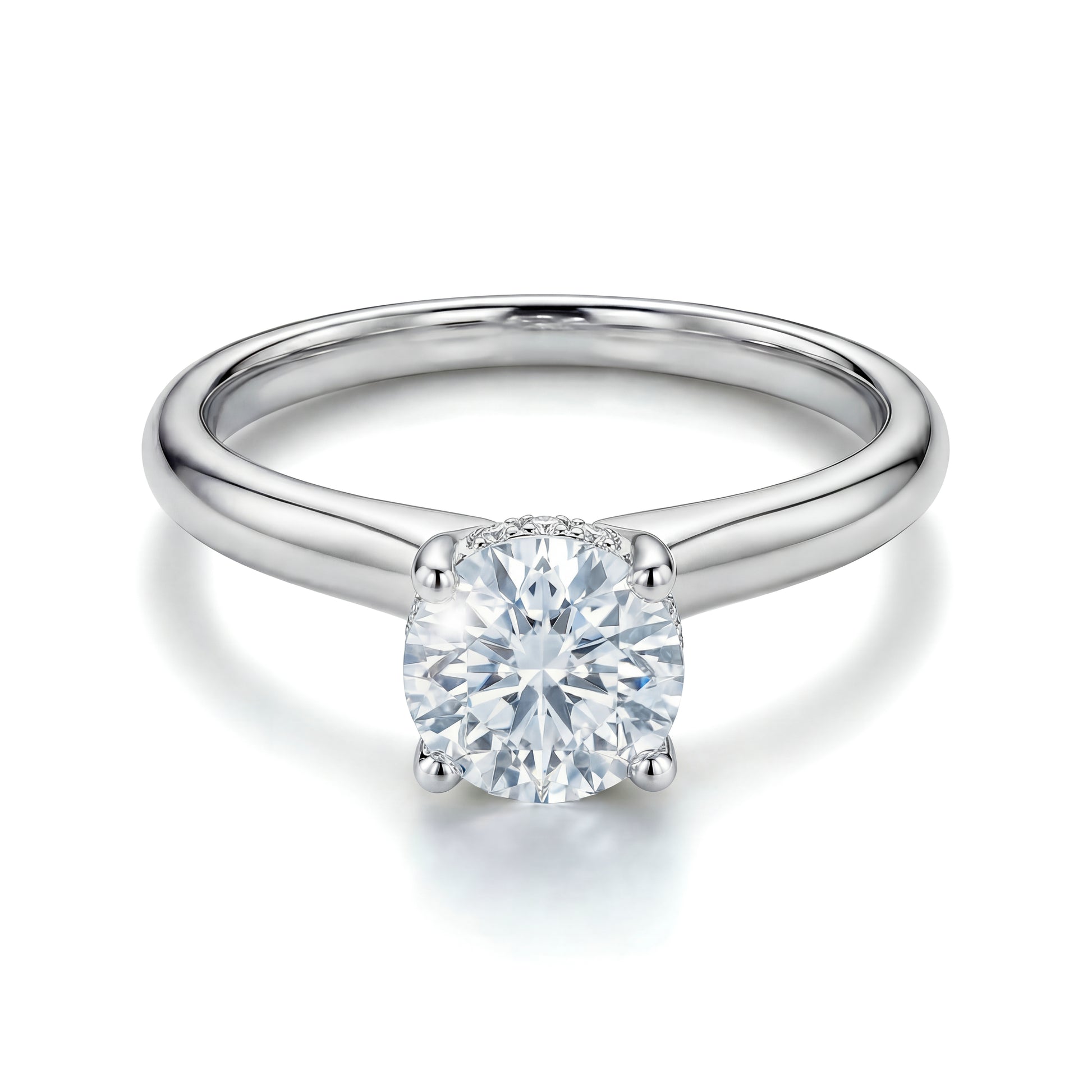 The Raffi&Co.® 14K White Gold Round Brilliant Lab Diamond Hidden Halo Engagement Ring features a round lab diamond in a classic four-prong setting, displayed on a white background.