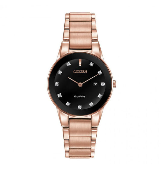 Introducing the CITIZEN Axiom Eco-Drive 28mm Watch from CITIZEN, which showcases a pink gold-tone metal band and case. It features a black dial adorned with crystal hour markers, slender rose gold hands, and includes a small date window located at the 3 o'clock position.