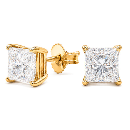 The Raffi&Co.® 14K Yellow Gold Princess Cut Lab Diamond Stud Earrings feature VS1-VS2 clarity lab diamonds in elegant four-prong settings, crafted in 14K yellow gold, with one earring displayed from the front and the other from the side.