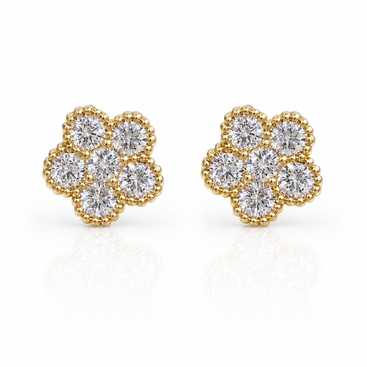 Roberto Coin Tennis Flower 18K Yellow Gold Diamond Stud Earrings, each with seven round diamonds and beaded edges, displayed on a white background.