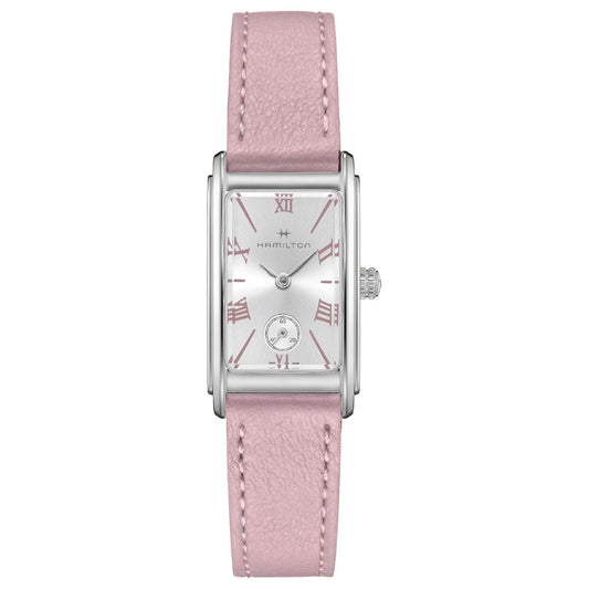 The Hamilton American Classic Ardmore Quartz 18.7mm x 27mm watch showcases a rectangular silver face adorned with pink Roman numeral markers and a small subdial at the bottom. Its Art Deco design includes a pink leather strap and a crown situated on the right side, while the dial prominently displays the Hamilton Watch name in stainless steel.