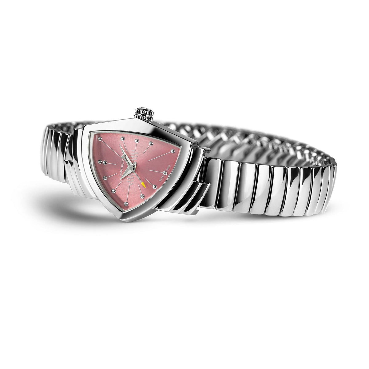 A stylish Hamilton Ventura S Quartz 24mm X 36mm watch by Hamilton Watch, featuring a flexible stainless steel bracelet and a distinctive pink, triangular face with delicate clear hour markers and silver hands, showcased against a white background. This eye-catching design takes inspiration from the iconic Ventura S Quartz model.