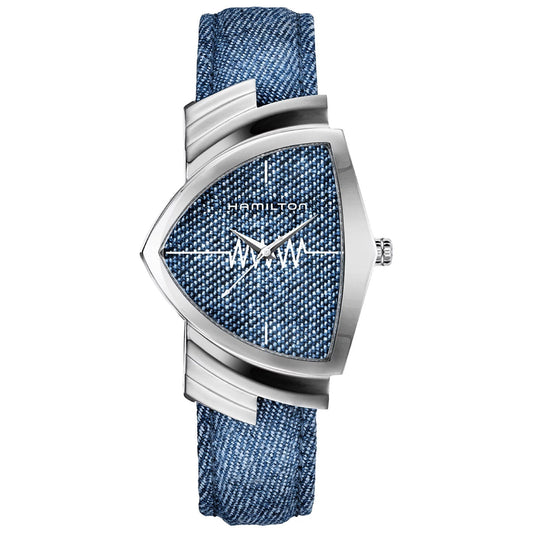 The Hamilton Ventura Quartz 32.3mm X 50.3mm Watch by Hamilton Watch features a blue textured face and a denim strap, highlighted by unique wavy hour and minute hands set within a geometric stainless steel frame, with the brand name "Hamilton" prominently displayed on the face.