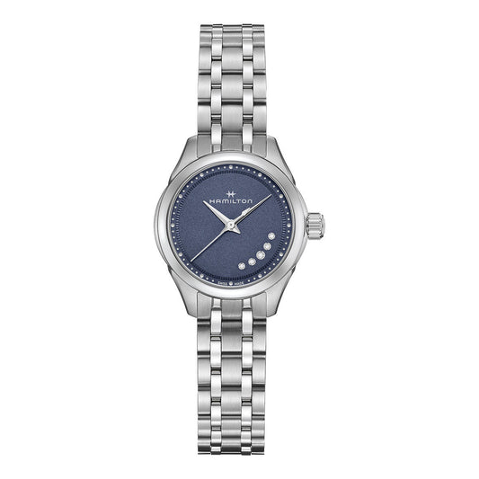 The Hamilton Jazzmaster Lady Quartz 26mm Watch, crafted by Hamilton Watch, is a silver wristwatch adorned with a radiant blue dial. It features sleek silver hour markers and hands, complemented by a sturdy metal link band. A small logo graces the top of the dial, all elegantly shielded by sapphire crystal for enduring brilliance.