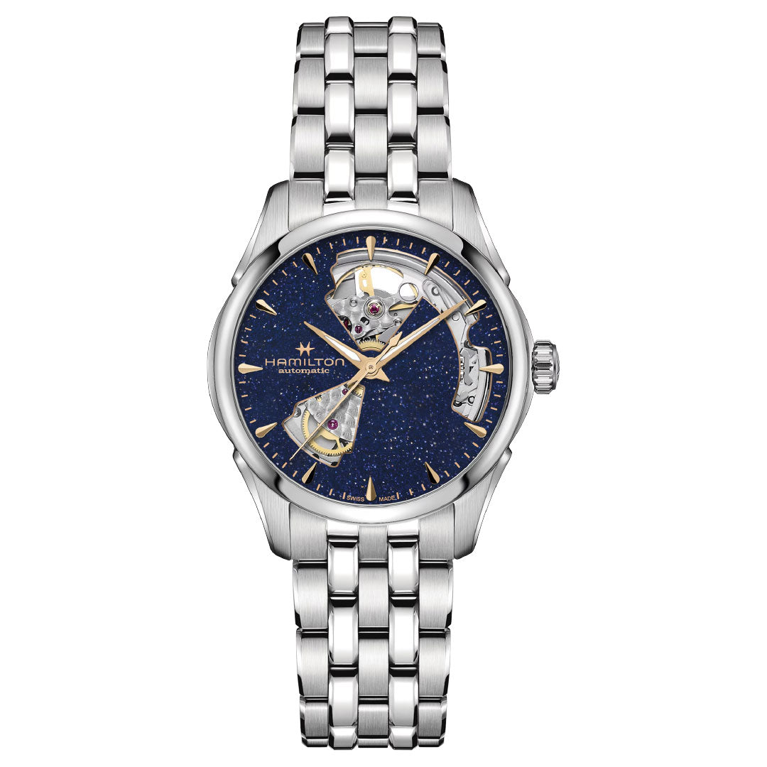 The Hamilton Jazzmaster Open Heart Lady Auto 36mm Watch by Hamilton features a silver case, metallic bracelet, blue partially skeletonized dial with gold-accented hour indices and hands, and showcases its automatic movement.