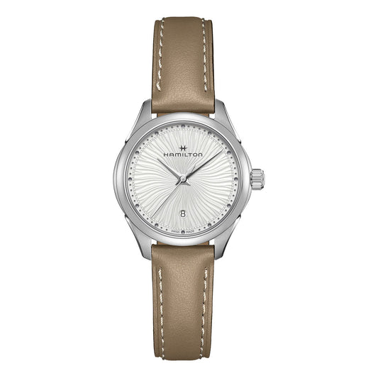 The Hamilton Jazzmaster Lady Quartz 30mm Watch by Hamilton Watch boasts a silver design paired with a light brown leather strap. It features a wavy-patterned light gray face, adorned with silver hour markers and the brand's logo at the top. The watch includes an elegantly placed date window at the bottom, secured by durable sapphire crystal.