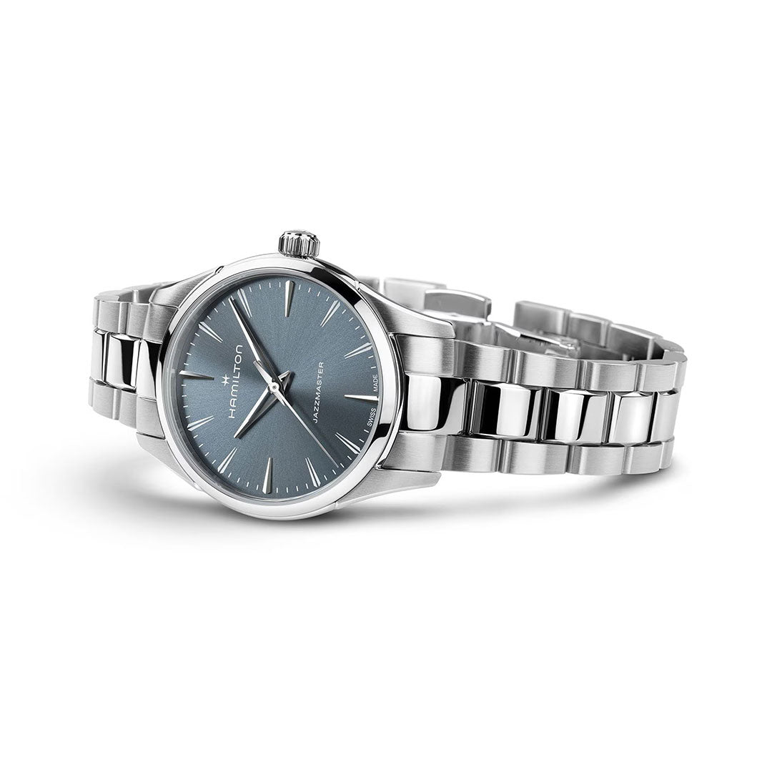 The Hamilton Jazzmaster Quartz 32mm Watch by Hamilton Watch, featuring a blue sunray dial, silver hour markers, and a metal link bracelet, is shown on a white background with the time set to 10:10.