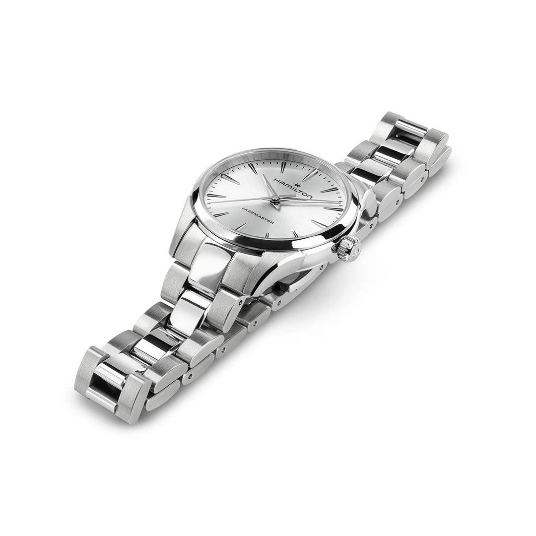 The Hamilton Jazzmaster Quartz 32mm Watch by Hamilton Watch features a silver stainless steel case, sunray-brushed dial, minimalist hour markers, and a metal link bracelet, shown on a white background.