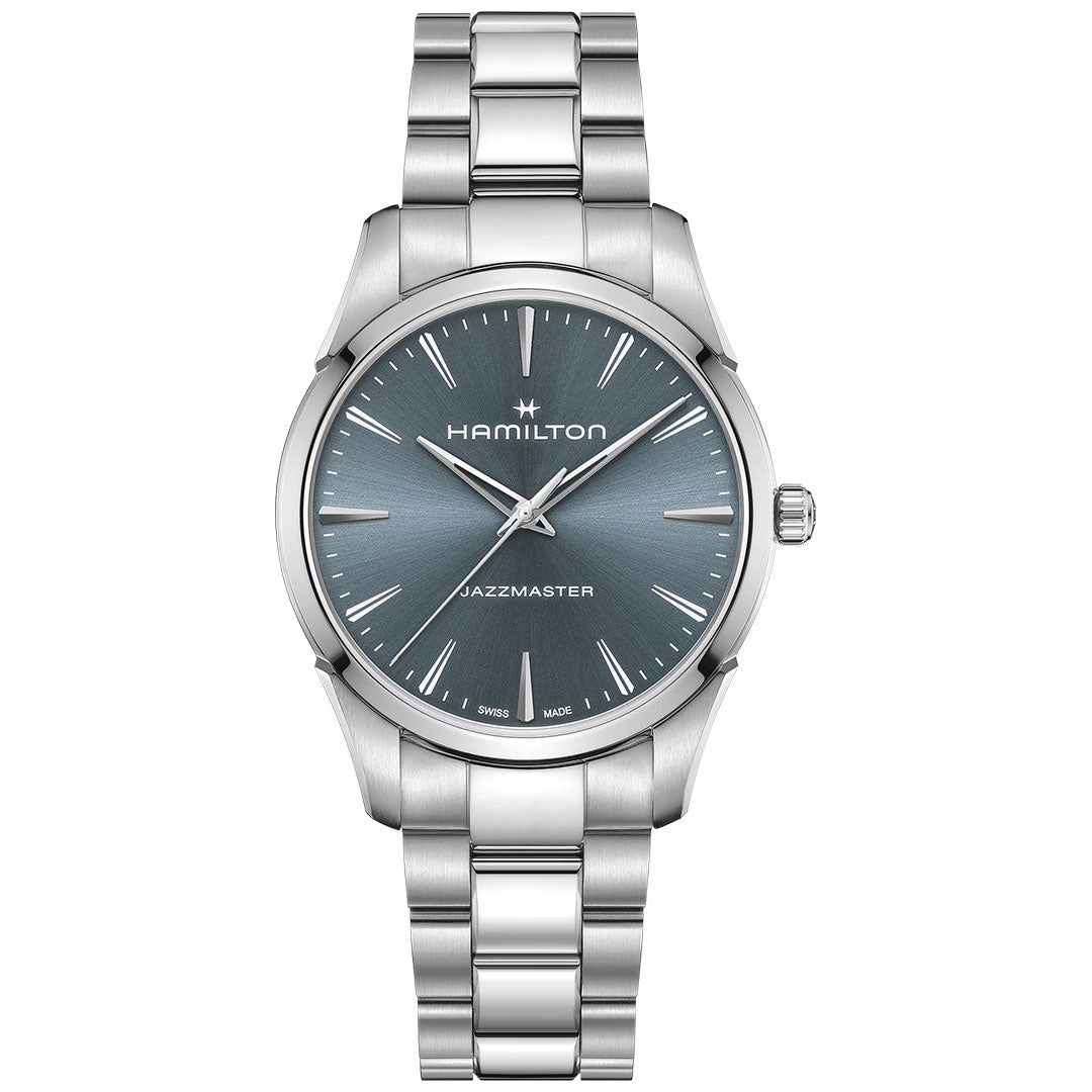 The Hamilton Jazzmaster Quartz 40mm Watch by Hamilton Watch features a silver metallic link band, an elegant blue-gray dial with silver hour markers and hands, and displays "Hamilton" and "Jazzmaster" on its modern blue face.