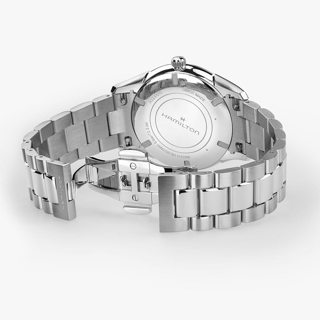 A close-up of the Hamilton Jazzmaster Quartz 40mm Watch by Hamilton Watch shows the metal bracelet, deployment clasp, and engraved case back details.