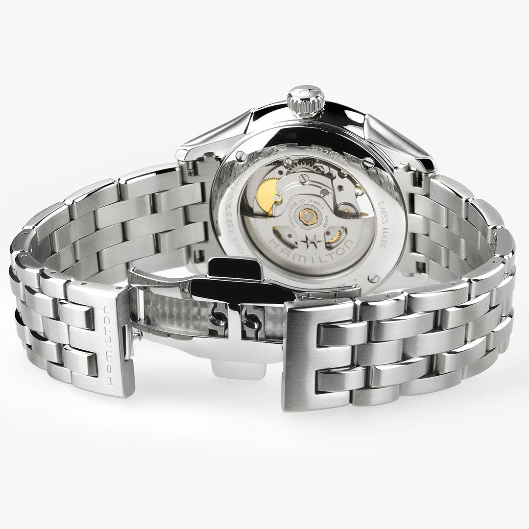 A close-up of the Hamilton Watch Jazzmaster Open Heart Auto 40mm, featuring a stainless steel band, transparent case back with visible movement, and an open clasp engraved "HAMILTON.