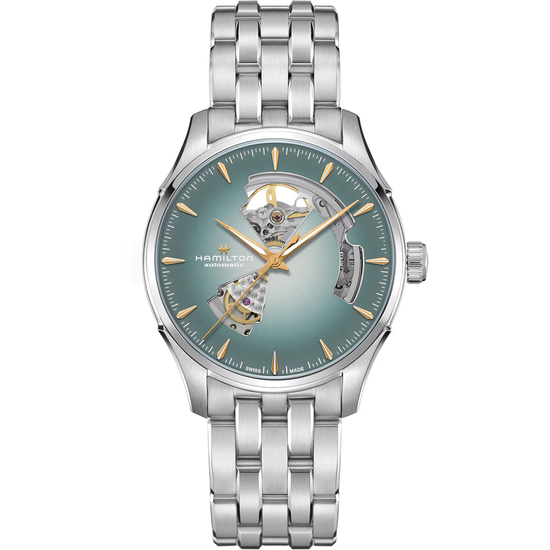The Hamilton Jazzmaster Open Heart Auto 40mm Watch by Hamilton Watch features a stainless steel band, teal sunburst dial, gold hands, and an open-heart design revealing the inner workings.