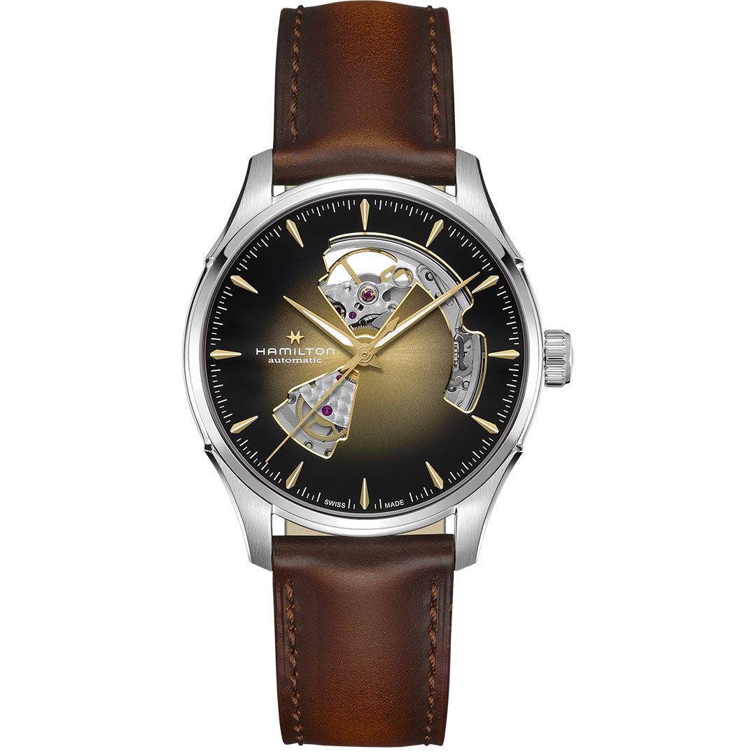 The Hamilton Jazzmaster Open Heart Auto 40mm Watch by Hamilton Watch features a brown leather strap, stainless steel case, gold and black gradient dial, gold hands, and an open section on the left revealing the movement.