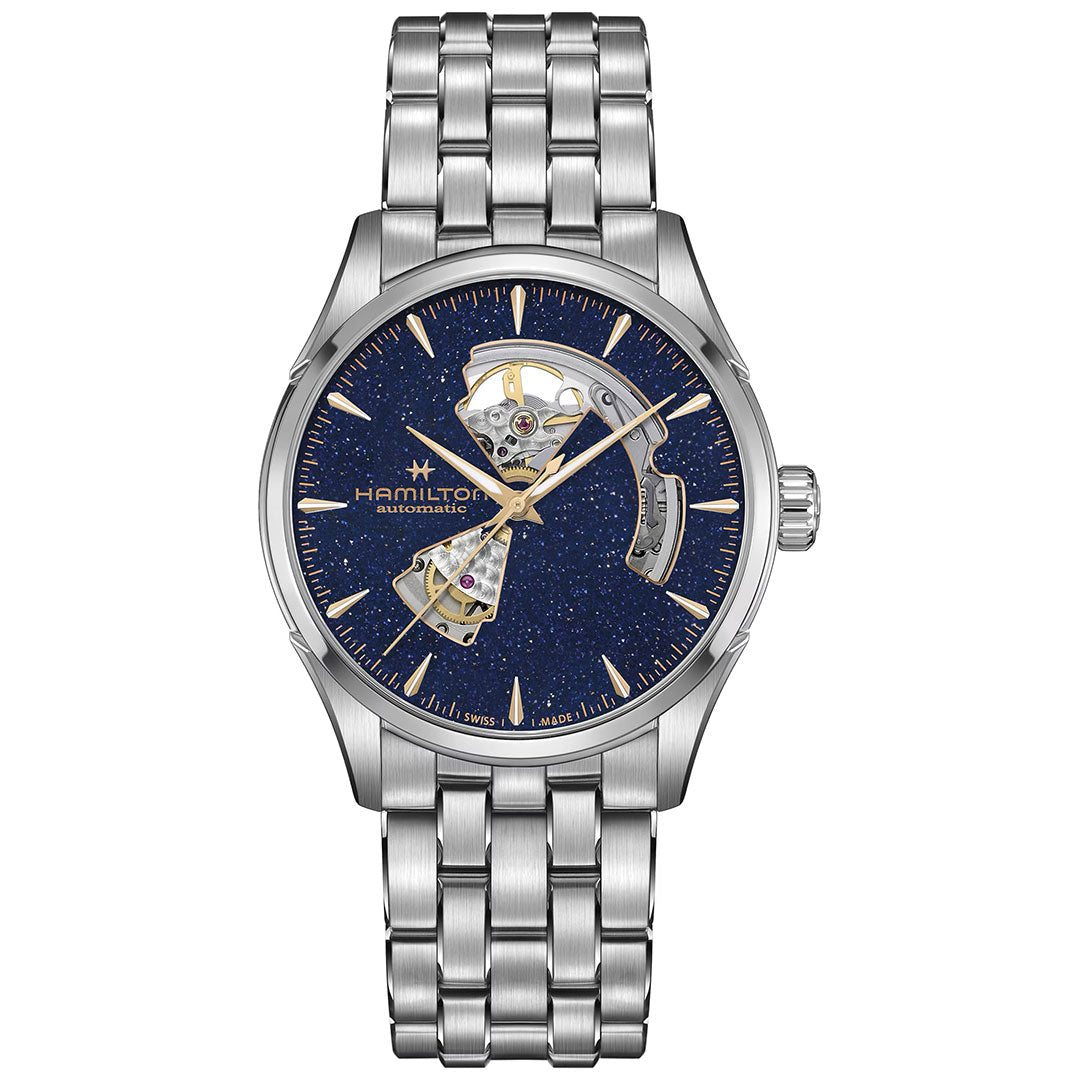 The Hamilton Jazzmaster Open Heart Auto 42mm by Hamilton Watch features a stainless steel case, blue speckled dial, exposed automatic movement, gold-tone markers and hands, metal link bracelet, and displays the Hamilton logo with "Automatic" text.