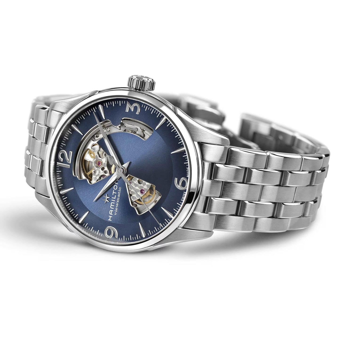 The Hamilton Jazzmaster Open Heart Auto 42mm by Hamilton Watch features a silver case, blue open-heart dial revealing its Swiss automatic movement, and a metal link bracelet, displayed angled on a white background.