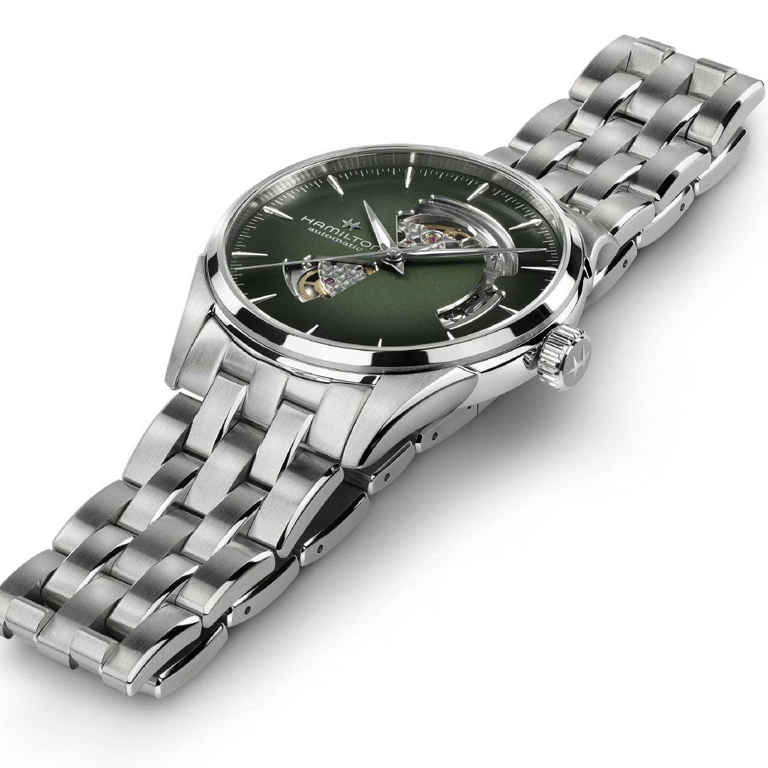 The Hamilton Jazzmaster Open Heart Auto 42mm Watch by Hamilton Watch features a silver metal band, green dial, silver markers, and an open-heart automatic movement—highlighting its polished case and intricate bracelet links for dress watch enthusiasts.