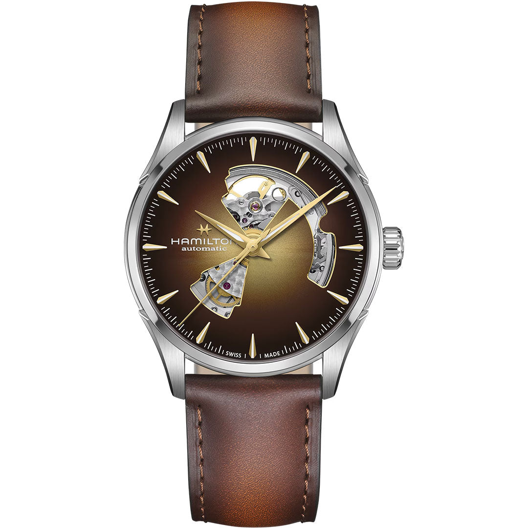 The Hamilton Jazzmaster Open Heart Auto 42mm Watch by Hamilton Watch features a brown leather strap, stainless steel case, and a brown gradient open-heart dial revealing the watch’s internal mechanism.