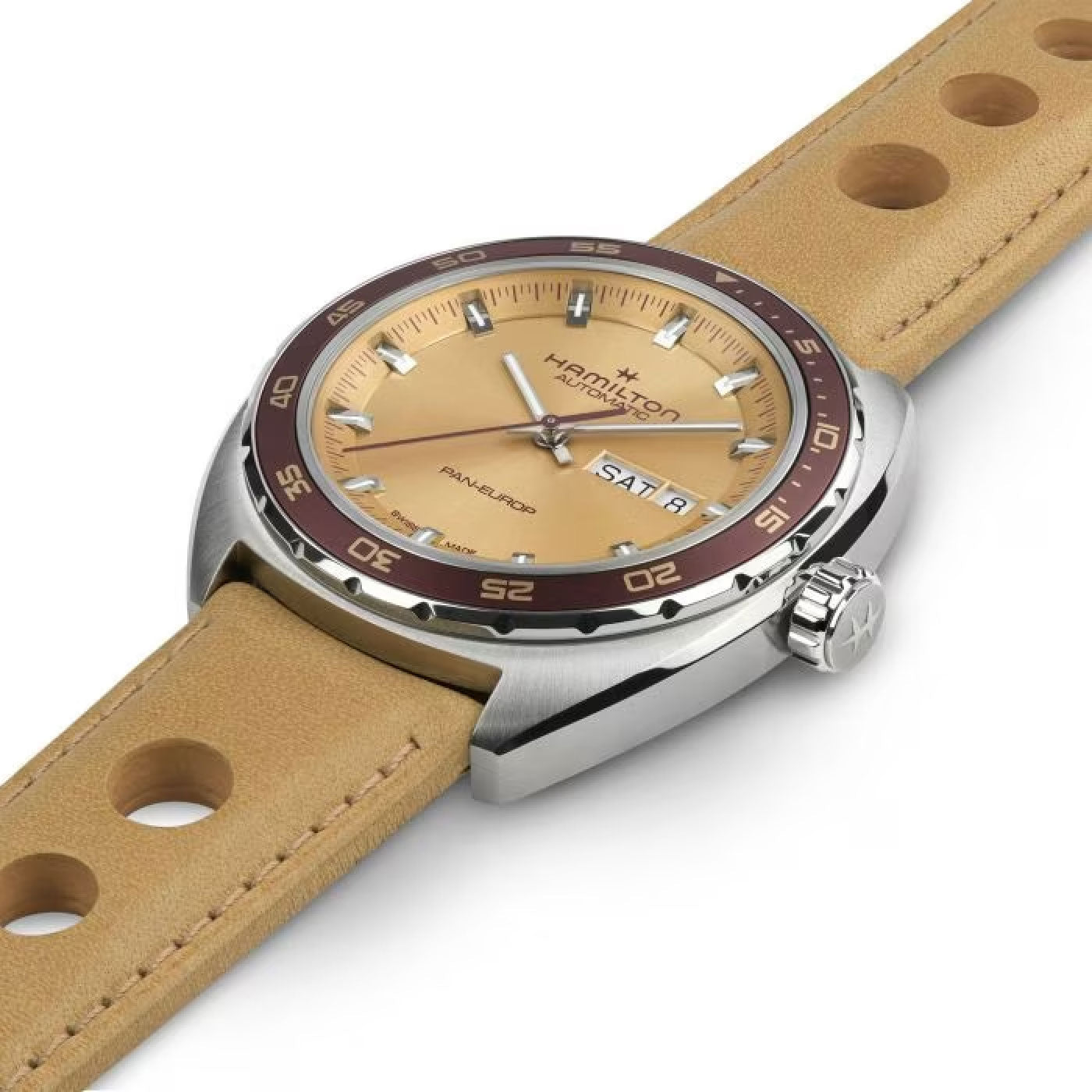 The Hamilton American Classic Pan Europ Day Date Auto 42mm Watch by Hamilton Watch includes a beige leather strap and dial, silver hour markers, a day-date window, and a rotating bezel with minute markings, along with a visible crown on the side.