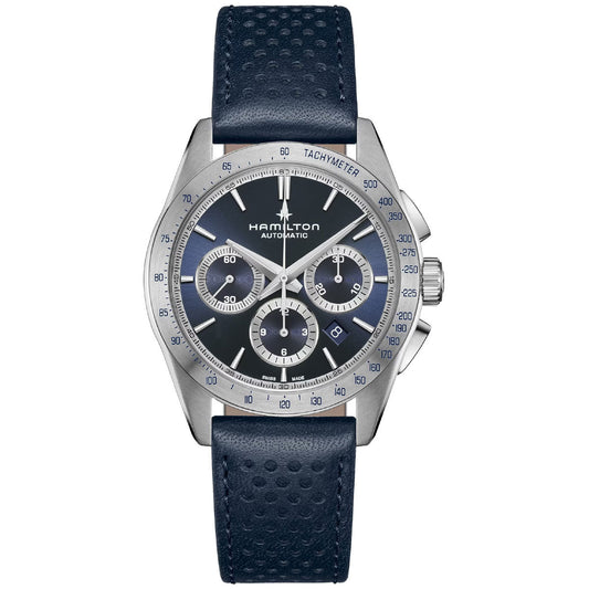 The Hamilton Jazzmaster Performer Auto Chrono 42mm Watch features a silver case with a dark blue leather strap. Its sport-chic design includes a tachymeter on the black dial, along with three subdials and an automatic chronograph functionality. Silver hands and markers nicely accentuate the Hamilton Watch brand name positioned below the 12 o'clock mark.